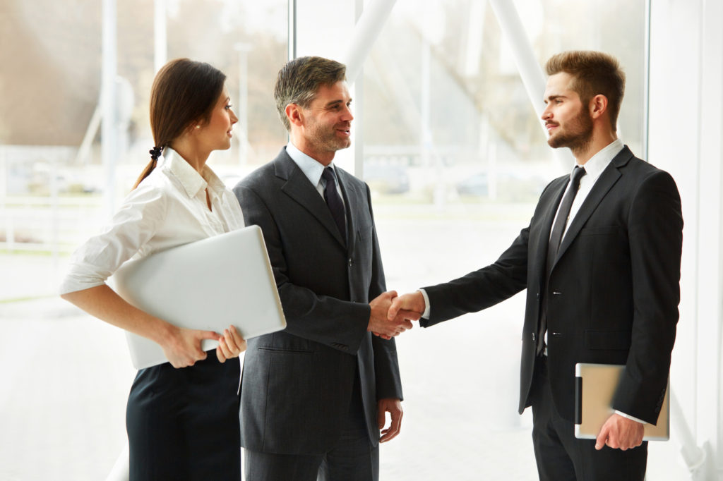 Business People. Successful Business Partner Shaking Hands in the office. Business Team